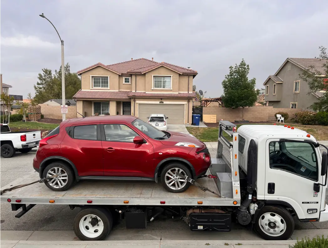 Lotus Towing truck picking up vehicle